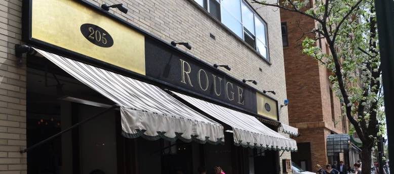 Rouge restaurant awning with sign