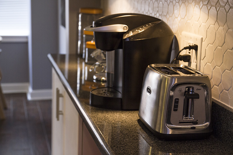 Keurig coffee maker and toaster on kitchen counter